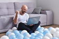 Young man in livingroom using laptop Royalty Free Stock Photo