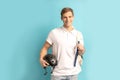 Positive young man in white t-shirt hold motorcycle helmet Royalty Free Stock Photo