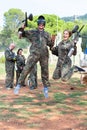 positive young man and woman in full paintball gear having fun after match Royalty Free Stock Photo