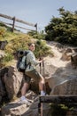 Positive young short haired female traveler