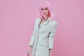 Positive young woman attractive look white blazer pink wig color background unaltered Royalty Free Stock Photo