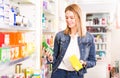 Female customer found medicines in pharmacy Royalty Free Stock Photo