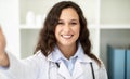 Positive young woman doctor taking selfie at clinic Royalty Free Stock Photo