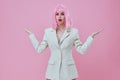 Positive young woman in White blazer pink hair Glamor Cosmetics color background unaltered Royalty Free Stock Photo