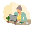 A positively smiling grandmother sits at the computer and studies, communicates with family