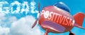 Positivism helps achieve a goal - pictured as word Positivism in clouds, to symbolize that Positivism can help achieving goal in