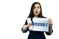 Positivity concept, woman tearing word impossible to make possible Royalty Free Stock Photo