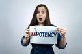 Positivity concept, woman tearing word impotence to make potence Royalty Free Stock Photo