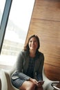 Positivity is a key component in career success. a happy young businesswoman sitting in an office chair. Royalty Free Stock Photo