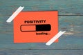 Positivity loading on paper Royalty Free Stock Photo