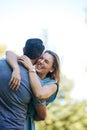 Possessions are immaterial, love is the true gold. a happy couple embracing in the park. Royalty Free Stock Photo