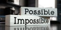 Possible, impossible - words on wooden blocks