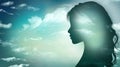 Woman face profile silhouette with sky and clouds background.Concept of thinking - psychology - imagination - intelligence or insp Royalty Free Stock Photo