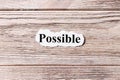 Possible of the word on paper. concept. Words of possible on a wooden background Royalty Free Stock Photo