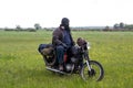 A post apocalyptic man on motorcycle in a meadow Royalty Free Stock Photo