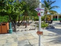 A post with arrows showing what direction and how many miles Half Moon Cay, Bahamas is from Fort Lauderdale, FL Royalty Free Stock Photo