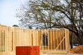 Post, beam and timber framing of new suburban wooden house with OSB (Oriented Strand Board) plywood sheathing