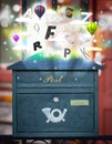 Post box with colorful letters Royalty Free Stock Photo