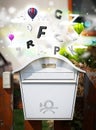 Post box with colorful letters Royalty Free Stock Photo