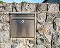 post box, embedded in a stone wall Royalty Free Stock Photo