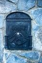 post box, embedded in a stone wall Royalty Free Stock Photo