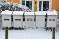Post boxes in front of apartment houses in winter Royalty Free Stock Photo