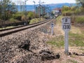 Post of elevation change railroad signal indicating the declination of the track 0 and the length in meters 1200 Royalty Free Stock Photo