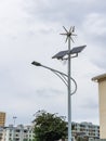 Post with led lantern with supply by solar panel and wind turbine