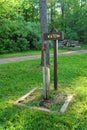 Water spigot on grassy campground with wood sign Royalty Free Stock Photo