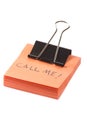 Post-it note with clip and message call me on white background Royalty Free Stock Photo