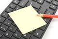 Post-it note, keyboard and pencil Royalty Free Stock Photo