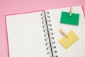 post it note with wooden clip stick isolated blank notebook. have pink on background. image for Royalty Free Stock Photo