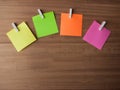 Post It Notes on Pegs On Light Wood