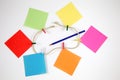 Post-it notes with small colored pegs in a rope and a blue pencil Royalty Free Stock Photo