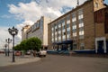 The post office with the Russian Post logo above the porch at the main railway station of the city, on a sunny summer day