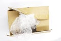 Post parcel box with package plastic on white background, Unboxing process top view photo. Carton box opening.