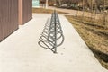 Post-and-ring style outdor metal bicycle parking racks at Fort Edmonton Park entrance