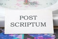 POST SCRIPTUM ancient Latin saying meaning - afterthought, afterwards text on a white business card Royalty Free Stock Photo