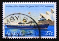 Postage stamp Australia, 1983. Royal Yacht Britannia passing Sydney Opera House Royalty Free Stock Photo