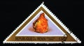 Triangle postage stamp Benin 1998. Uraninite mineral gemstone