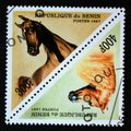 Triangle postage stamp Benin 1997. Horse Equus ferus caballus