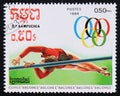 Postage stamp Cambodia 1988, woman uneven bars exercise