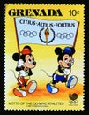 Postage stamp Grenada 1988. Morty and Ferdie carrying banner with Olympic motto