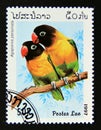 Postage stamp Laos, 1997. Masked Lovebird Agapornis personata bird Royalty Free Stock Photo