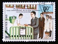 Postage stamp Laos, 1990. Visiting the hospital