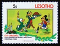 Postage stamp Lesotho 1983. The Christmas Dinner Donald, Goofy, Mickey Royalty Free Stock Photo