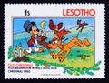 Postage stamp Lesotho 1983. Christmas Eve Mickey, Scamp, Lady, Pluto, Tramp Royalty Free Stock Photo