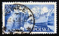 Postage stamp Poland, 1956. Dock worker and S.S.Pokoj freighter ship