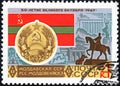 Post stamp printed in the USSR shows Coat of Arms, Flag and monument Moldovan SSR, serie `50 years of the Great October`.