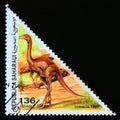 Triangle postage stamp 1997. Struthiomimus dinosaur